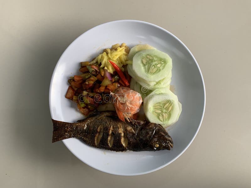 Grilled Tilapia with Chunks of Mango, Tomato, Cucumber, and Boiled