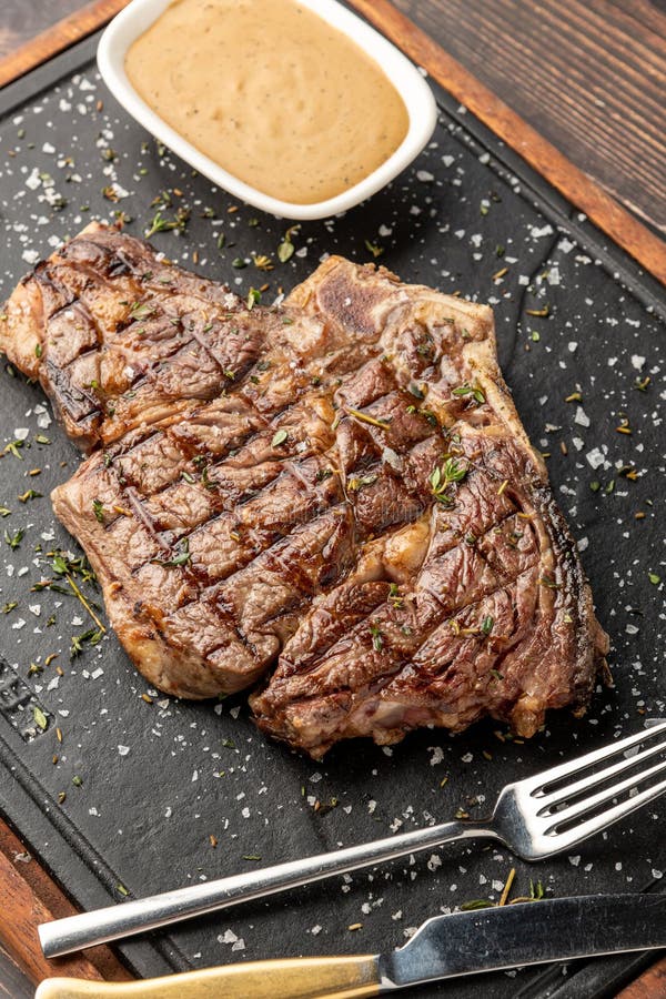 Grilled Tomahawk Steak on Stone Cutting Board in Steakhouse Restaurant Stock Image Image of