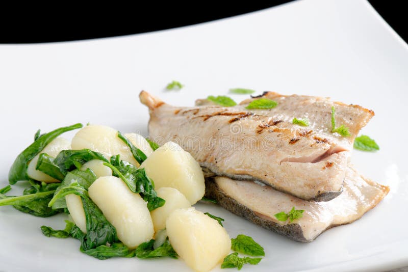 Grilled white fish fillets with potato