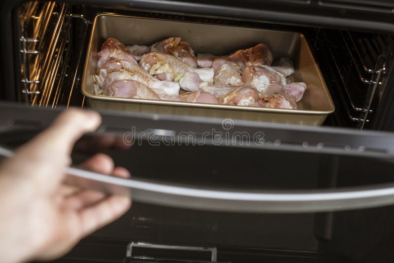 Grilling chicken legs stock image. Image of temperature 245714593