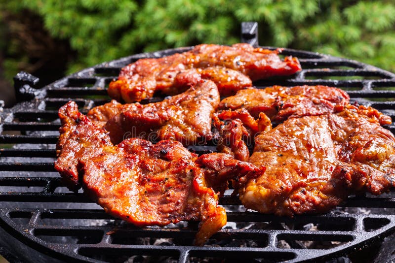Grilling Pork Steaks on Barbecue Grill Stock Photo Image of meal