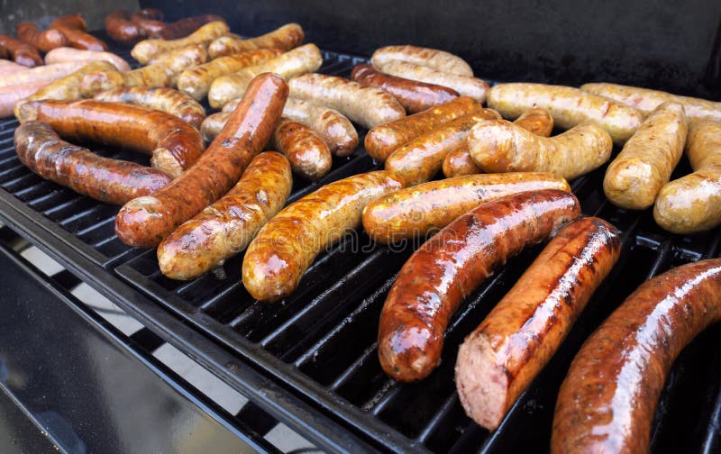 Grilling Sausage royalty free stock photo