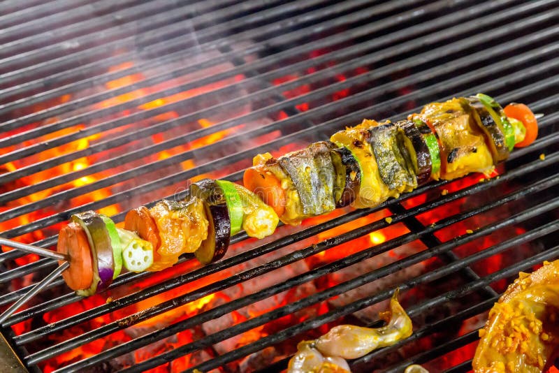 Grilling shashlik on barbecue grill.