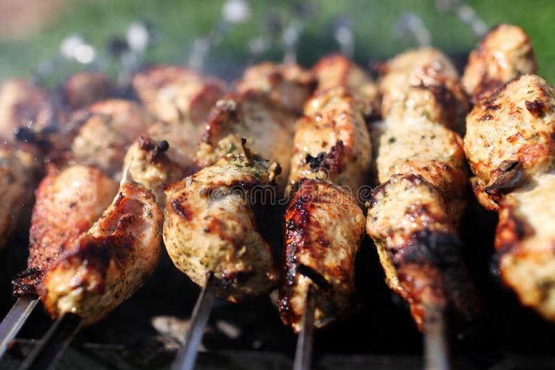 Grilling marinated shashlik on a grill. Roasted skewer grill stock images, royalty-free photos and pictures