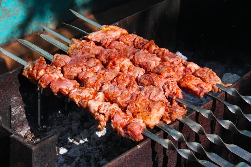 Grilling skewers or shashlik on barbecue grill. Selective focus