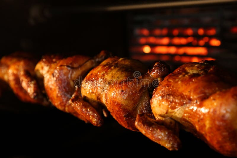 Grilling Whole Chickens in Rotisserie Machine, Closeup Stock Image