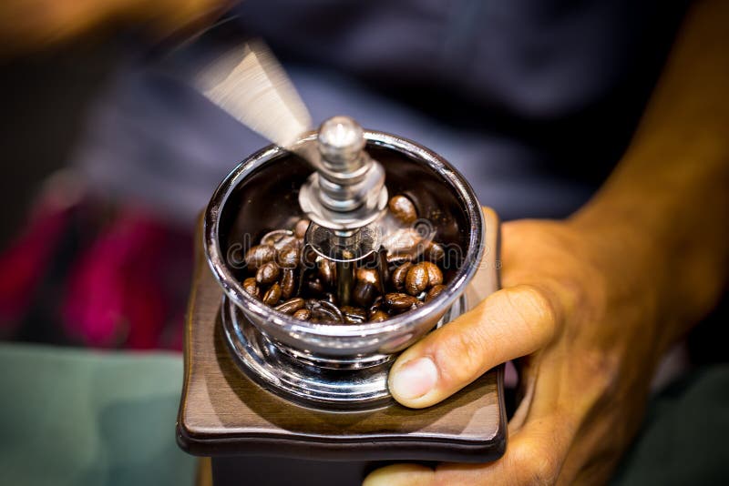 Grinder with coffee beans stock image. Image of concept 225936097