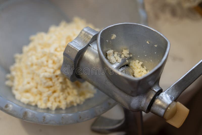 Grinding Cheese with a Meat Grinder Stock Photo Image of grater