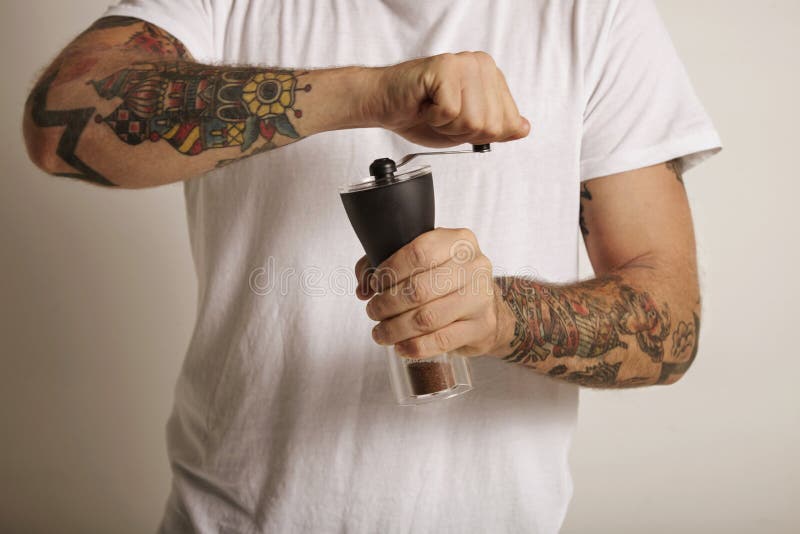 Grinding coffee with a manual grinder royalty free stock photos Grinding coffee with a manual grinder royalty free stock photos