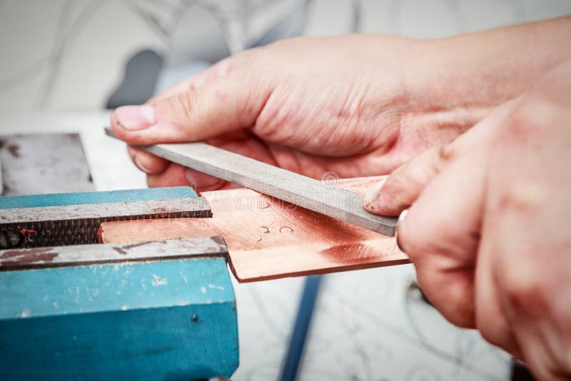 Grinding the Copper Billet with a File Stock Photo Image of machinery, manufacturing 121479662