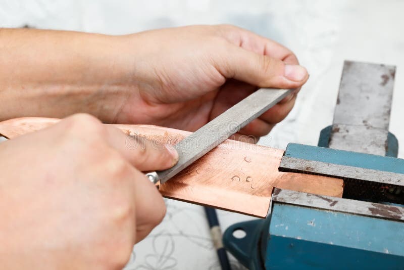 Grinding the Copper Billet with a File Stock Photo Image of component, machinery 125808050