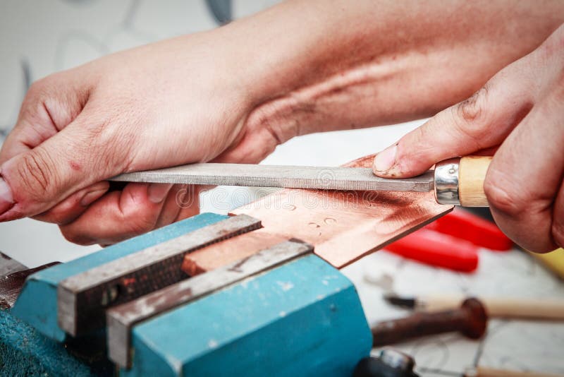 Grinding the Copper Billet with a File Stock Photo Image of machinery, copper 125807722
