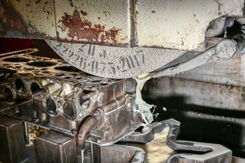 Grinding the Surface of the Cylinder Head on a Surface Grinder Stock