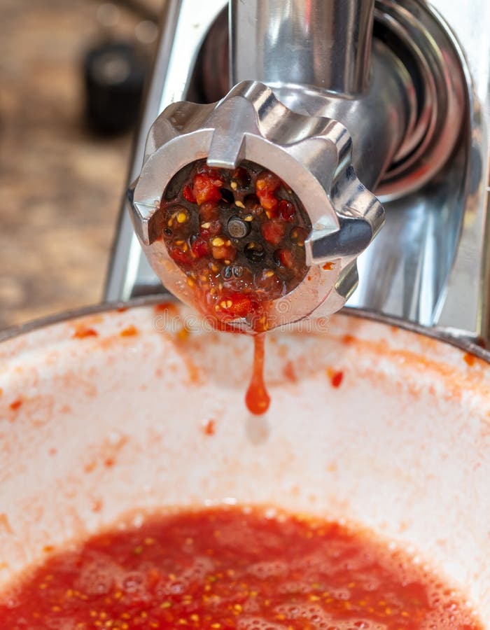 Grinding Tomatoes through a Meat Grinder Stock Image Image of home