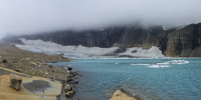 Grinnell Glacier and Mt Gould Covered with Blanket of Clouds. Grinnell Glacier with Mt Gould covered with Blanket of Clouds. Located in Many Glacier an area of royalty free stock photos Grinnell Glacier and Mt Gould Covered with Blanket of Clouds. Grinnell Glacier with Mt Gould covered with Blanket of Clouds. Located in Many Glacier an area of royalty free stock photos