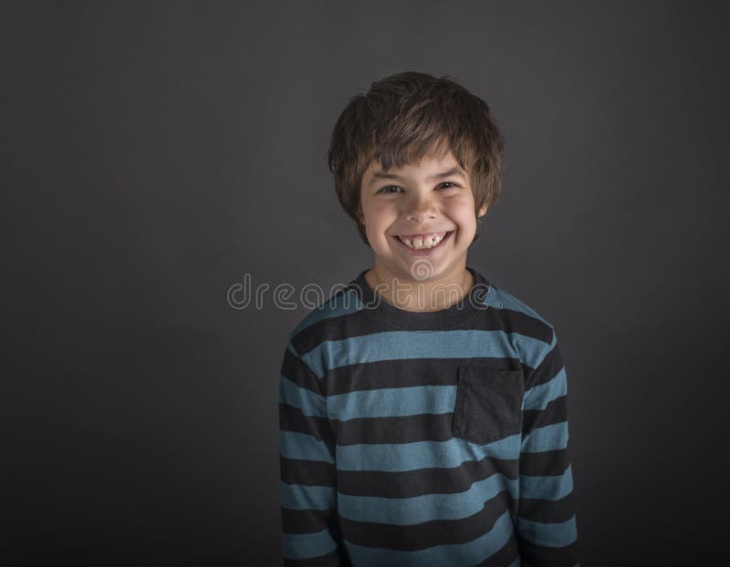 Grinning boy in striped shirt stock photo Grinning boy in striped shirt stock photo