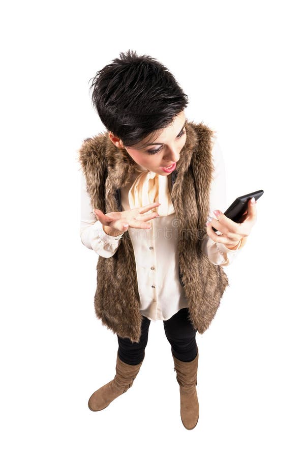 Grito frustrante bonito da menina em seu smartphone móvel fotos de stock Grito frustrante bonito da menina em seu smartphone móvel fotos de stock