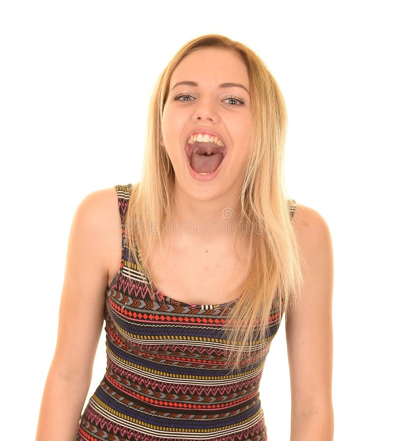 Teenage blonde girl with long hair wearing print dress with mouth open shouting. Teenage blonde girl with long hair wearing print dress with mouth open shouting.