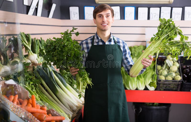 Grocery worker selling vegetables