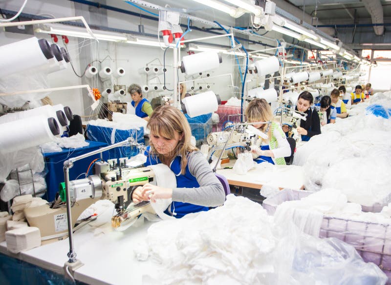 GRODNO, BELARUS - DECEMBER 13, 2013: Seamstress in Textile Factory ...