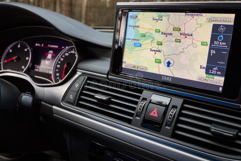 GRODNO, BELARUS - DECEMBER 2019: Audi A6 4G C7 interior in dark tones with display with GPS navigation map multimedia system climate control panels, example of modern car technological equipment. GRODNO, BELARUS - DECEMBER 2019: Audi A6 4G C7 interior in dark tones with display with GPS navigation map multimedia system climate control panels, example of modern car technological equipment.