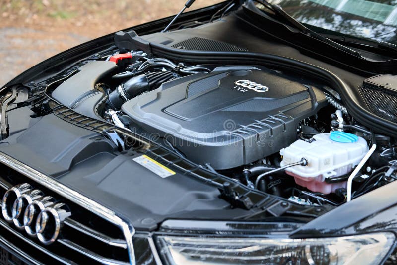 GRODNO, BELARUS - DECEMBER 2019: Audi A6 4G, C7 2.0 TDI 190 Hp 2016 diesel motor compartment of modern luxury car closeup engine left side view. Internal combustion engine, car parts detailing. GRODNO, BELARUS - DECEMBER 2019: Audi A6 4G, C7 2.0 TDI 190 Hp 2016 diesel motor compartment of modern luxury car closeup engine left side view. Internal combustion engine, car parts detailing.