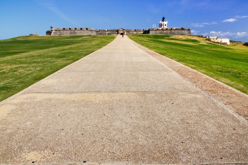 A low level view of the grounds of the historic Castillo San Felipe del Morro, or the San Felipe del Morro Castle which allows plenty of room for text and title insertion. The former fortress sits at the entrance to the harbor of Old San Juan, Puerto Rico. The lighthouse pictured here is still in use today to mark the entrance to San Juan Bay. It is a very popular vistor attraction and one of the most recognizable landmarks in the Caribbean. A low level view of the grounds of the historic Castillo San Felipe del Morro, or the San Felipe del Morro Castle which allows plenty of room for text and title insertion. The former fortress sits at the entrance to the harbor of Old San Juan, Puerto Rico. The lighthouse pictured here is still in use today to mark the entrance to San Juan Bay. It is a very popular vistor attraction and one of the most recognizable landmarks in the Caribbean.