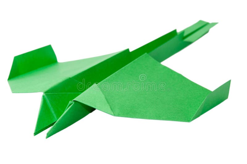 Groen origamivliegtuig met staart op de witte achtergrond stock fotografie Groen origamivliegtuig met staart op de witte achtergrond stock fotografie