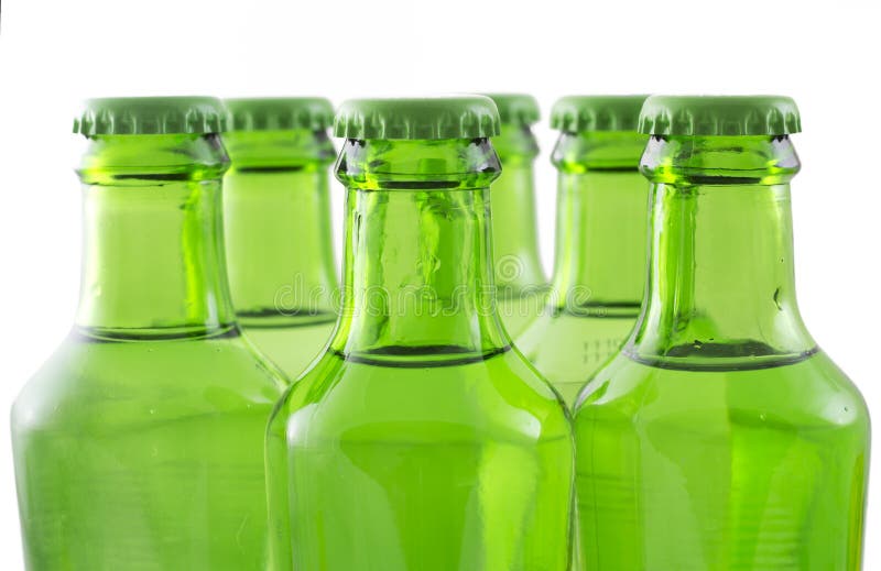 green bottles of soda water on white background. green bottles of soda water on white background