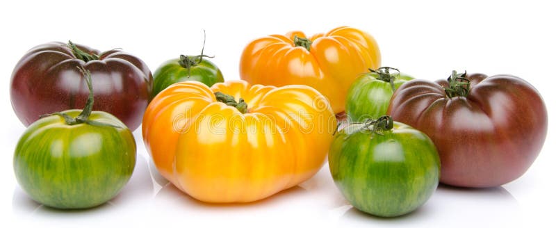 Groene, gele en purpere tomaten royalty-vrije stock foto's Groene, gele en purpere tomaten royalty-vrije stock foto's