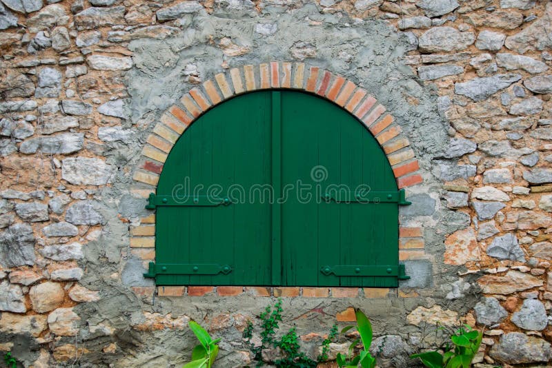 Green wooden door in the old Spanish rural house, Spain. Green wooden door in the old Spanish rural house, Spain