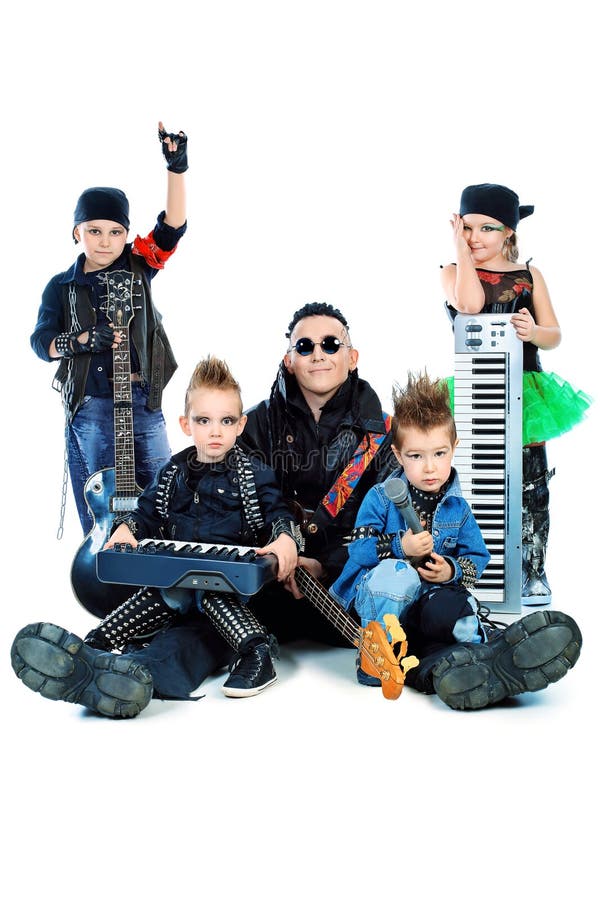 Heavy metal musician with a group of stylish children. Shot in a studio. Isolated over white background. Heavy metal musician with a group of stylish children. Shot in a studio. Isolated over white background.