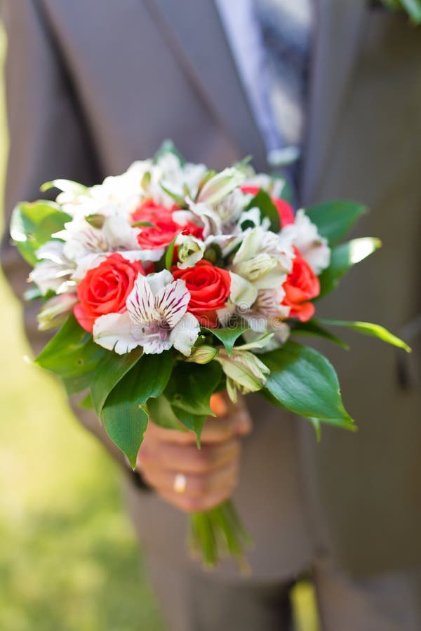 The groom with a bouquet stock photo. Image of marriage 21039966