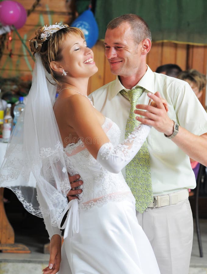 The groom and the bride dance.