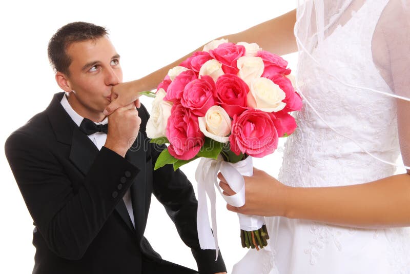 Groom Kissing Bride at Wedding stock photography