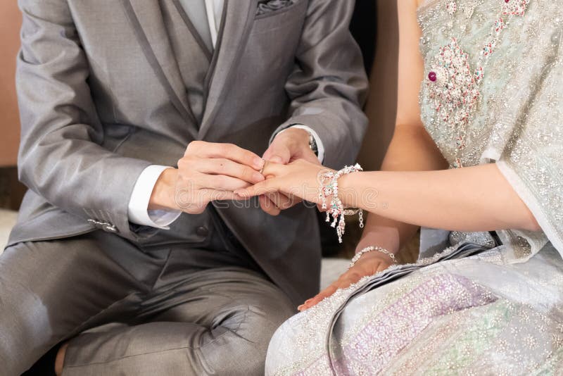 The Groom Put a Wedding Ring into a Bride Finger InThai Wedding Stock Photo Image of commit