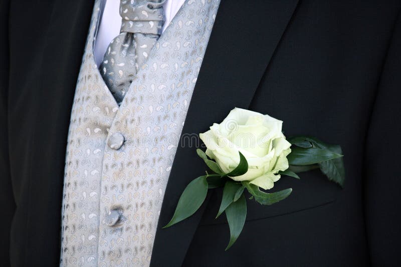 Groom suit with white rose