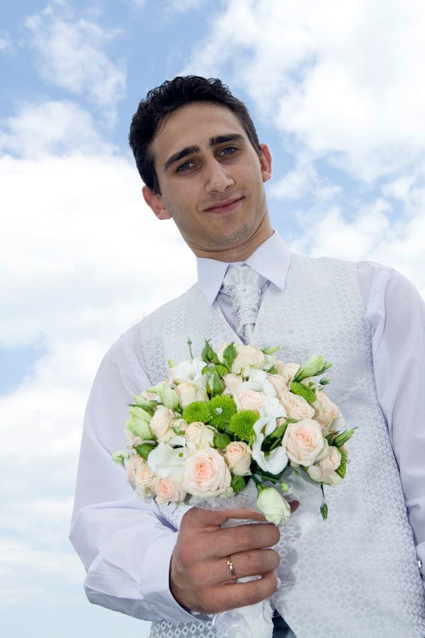 Groom with wedding bouquet