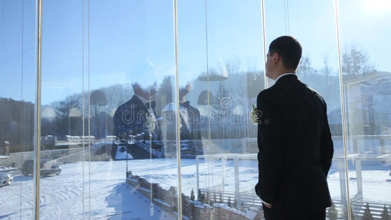 Groom at the window terrace