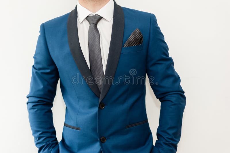 Close-up shot of a man dressed in formal wear .Grooms suit