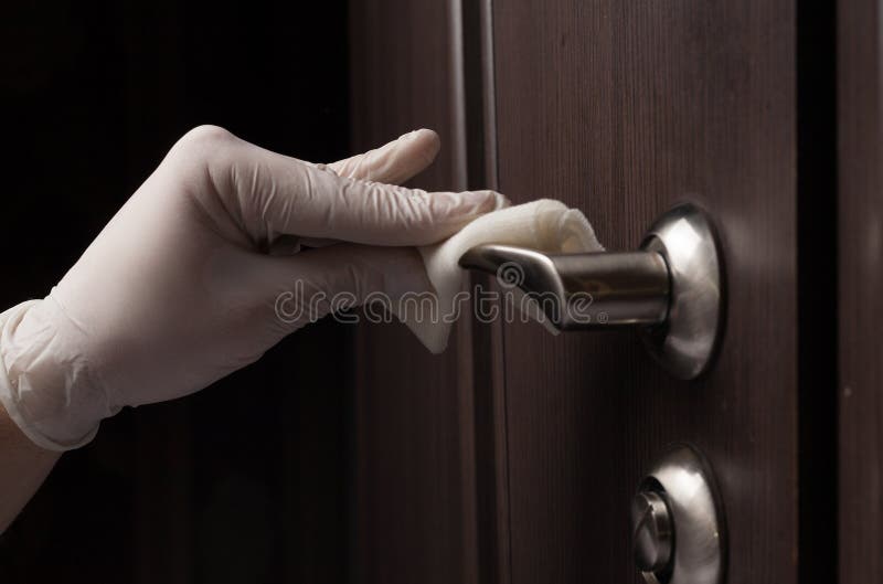 Close-up of disinfection, cleaning and washing of door handles in white gloves. Coronavirus infection prevention. Close-up of disinfection, cleaning and washing of door handles in white gloves. Coronavirus infection prevention.