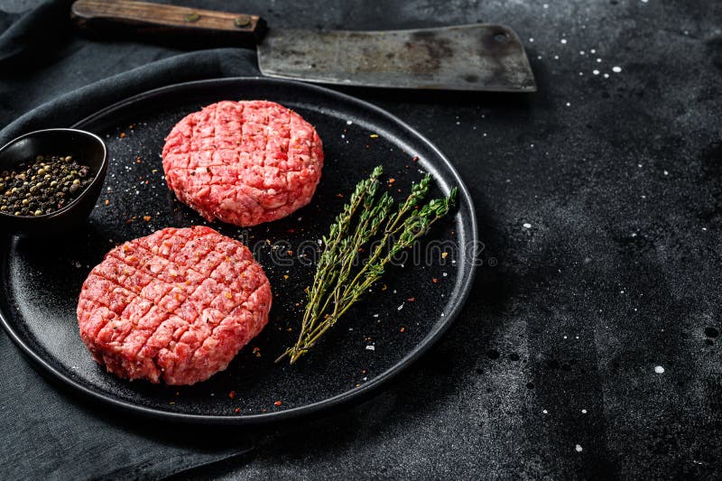 The Ground Beef Patties, Minced Meat Cutlets. Black Background. Top