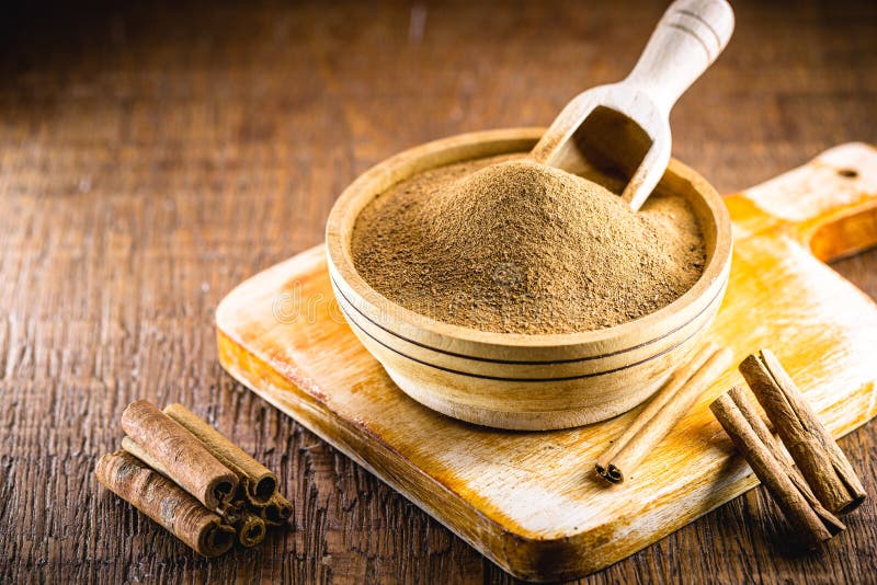 Ground Cinnamon and Ground Cinnamon, with a Spot Focus Stock Photo