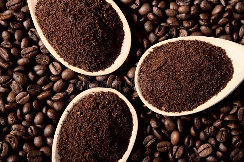 Ground coffee on coffee beans