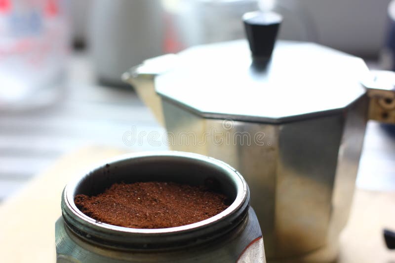 Ground Coffee in the Funnel of a Geyser of Coffee Pot Stock Photo