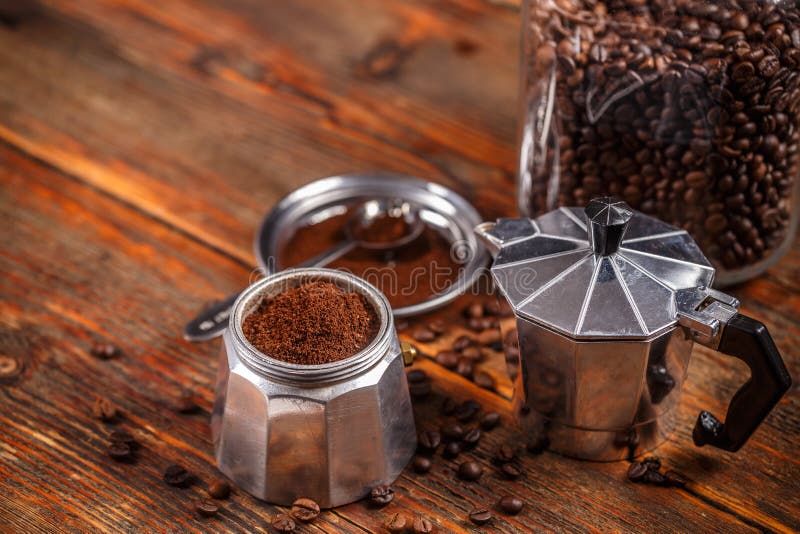 Ground coffee and moka pot stock photo. Image of traditional 92388172