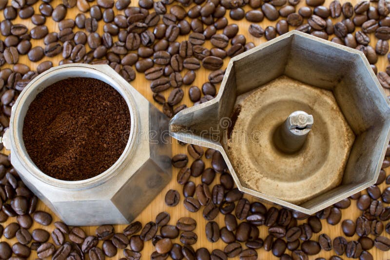 Ground coffee in moka pot. stock image. Image of