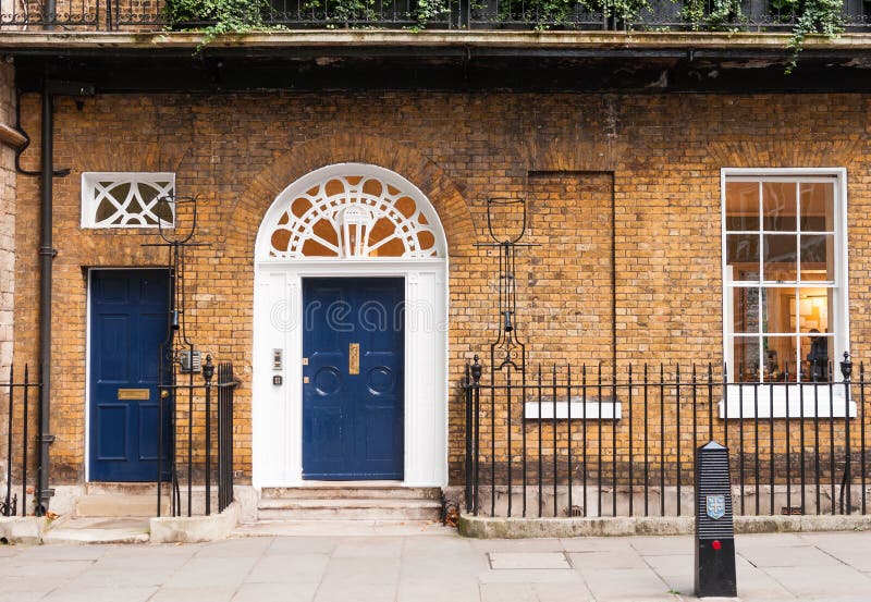 Ground floor brick wall facade of a victorian house in London, England