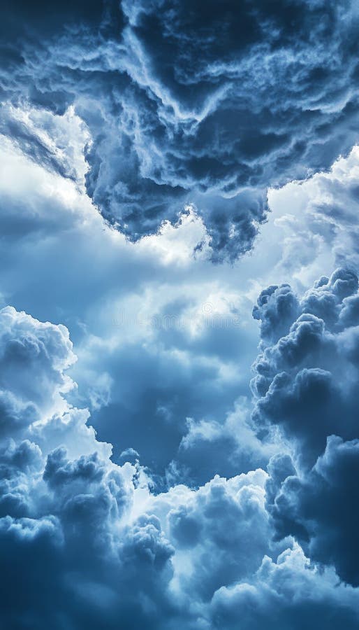 Ground level view of a turbulent sky filled with dramatic clouds in a striking composition stock illustration