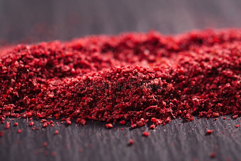 Ground Red Sumac Berries on black plate